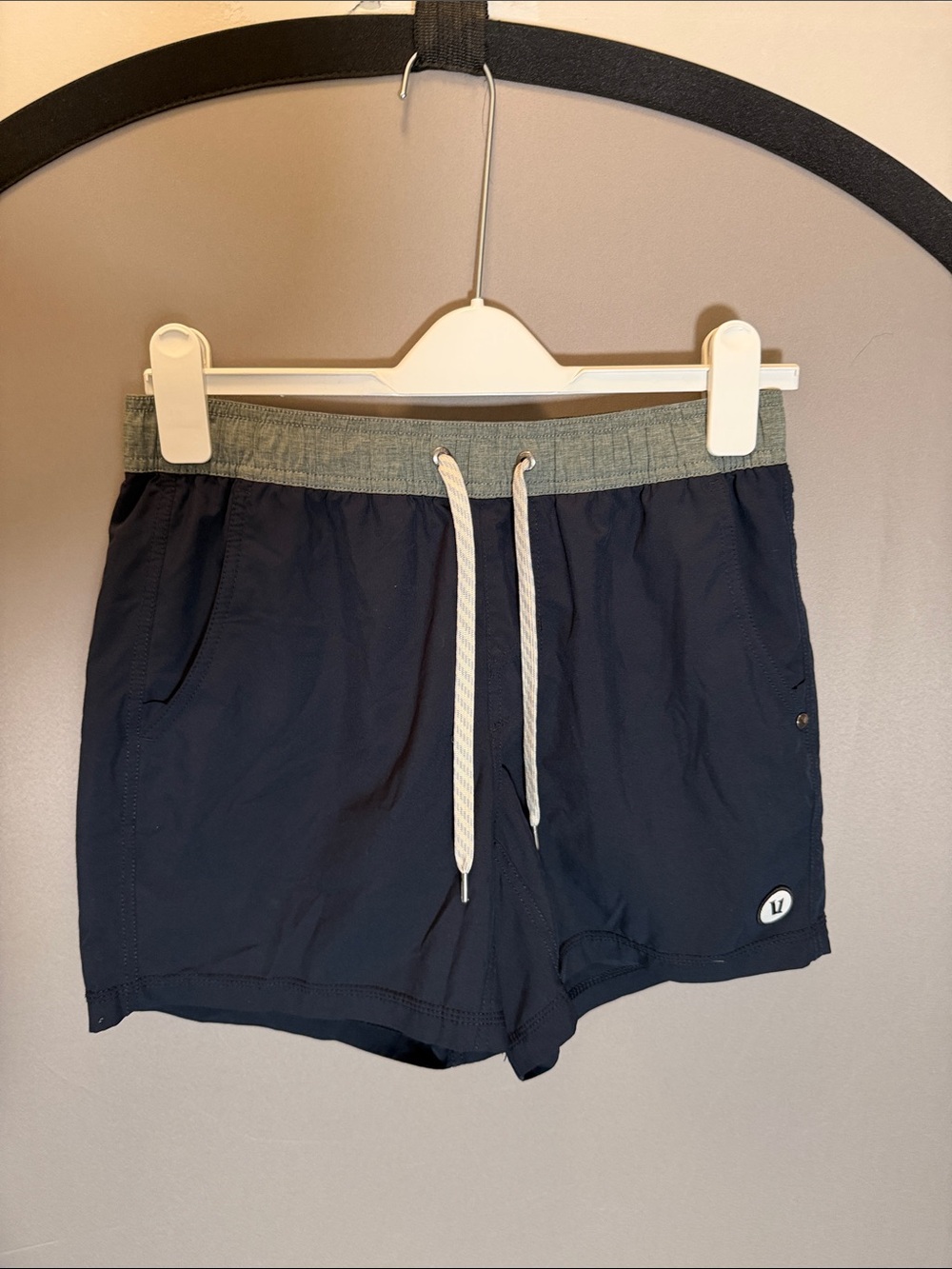 Vuori Navy Athletic Kore Shorts with Gray Waistband and White Drawstring